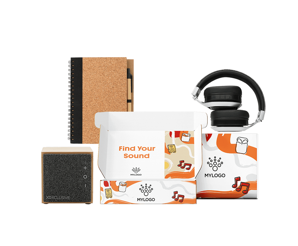 Pack tecnológico corporativo con auriculares inalámbricos, altavoz Bluetooth de bambú y libreta de corcho en caja regalo personalizable.